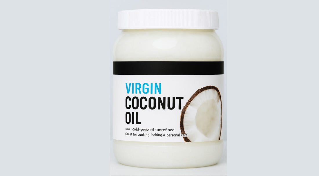 A jar of raw, cold-pressed, unrefined virgin coconut oil with a clean label and halved coconut image