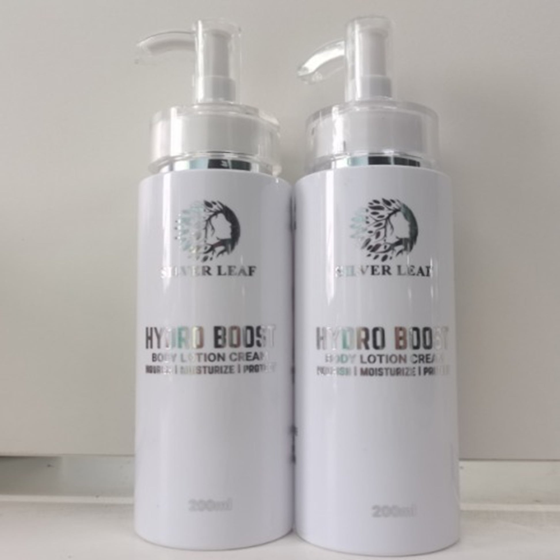 Silver Leaf Natural Moisturizing Lotion 200ml bottle with Virgin Coconut Oil, Jojoba Oil, and Aloe Vera.